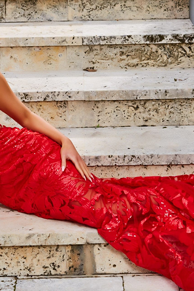 Model wearing Jovani style 02895 red prom dress