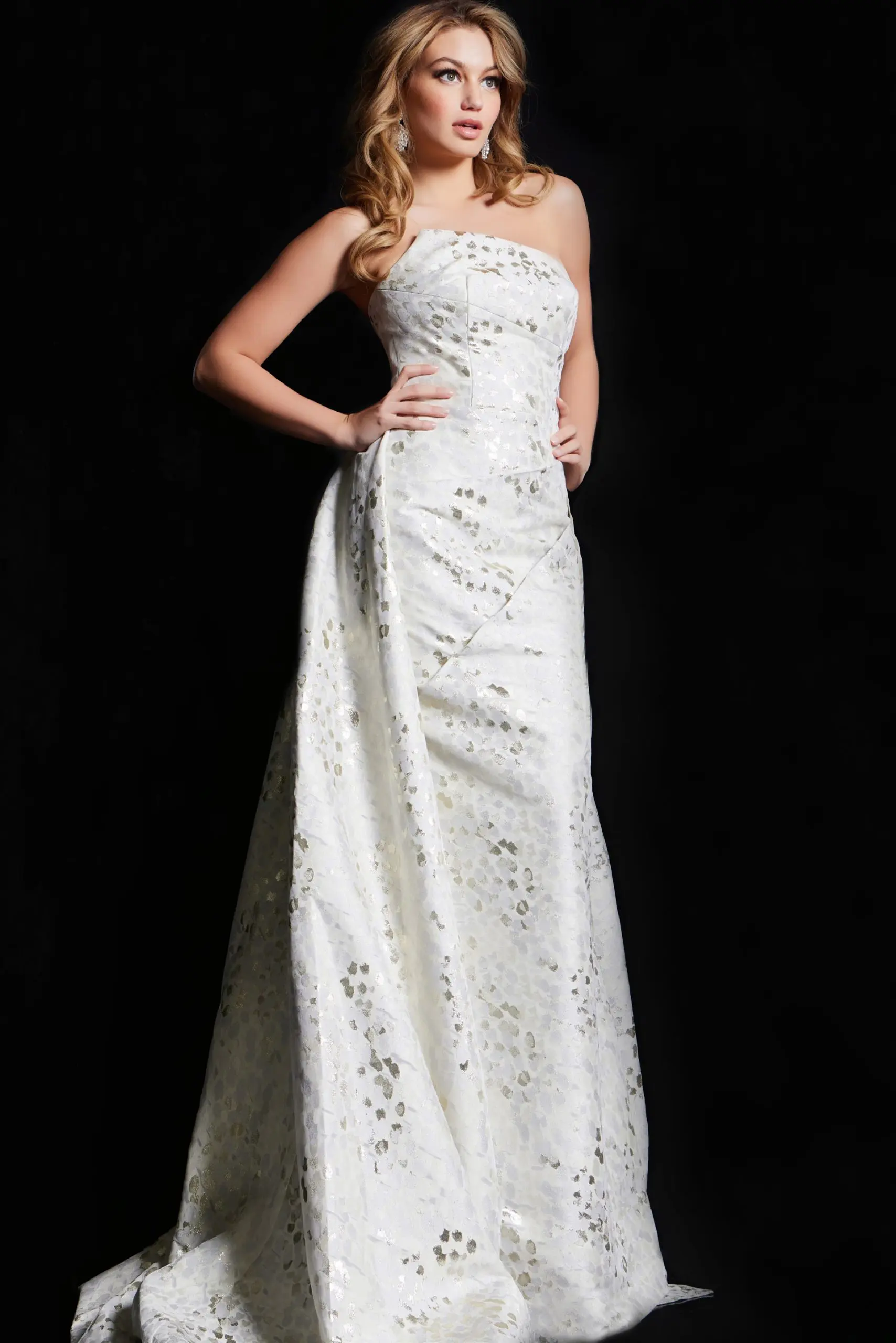 model wearing 06255 elegant beige gown with strapless neckline and textured fabric