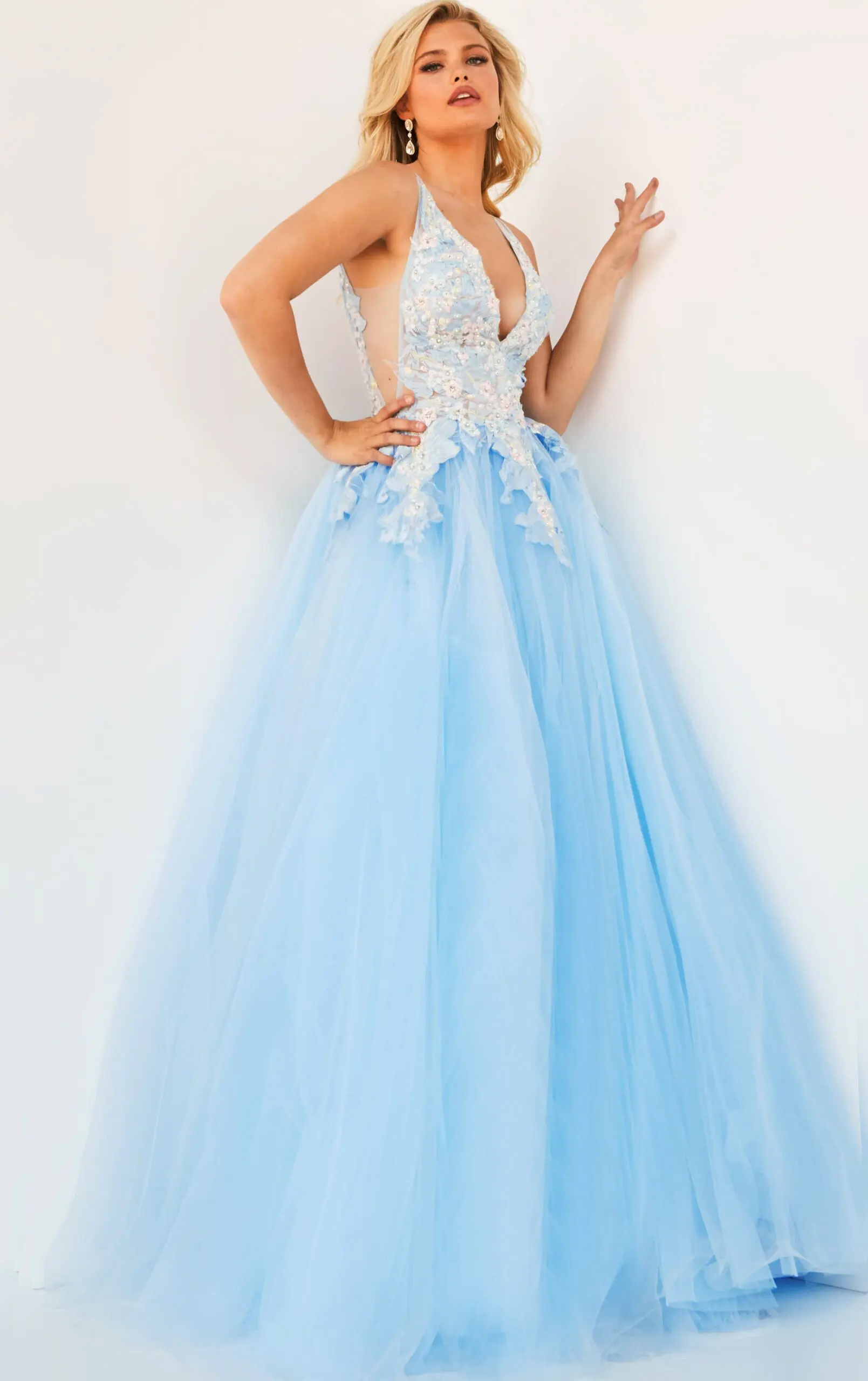 Model wearing Jovani 06808 blue gown with floral lace bodice and tulle skirt, front view.
