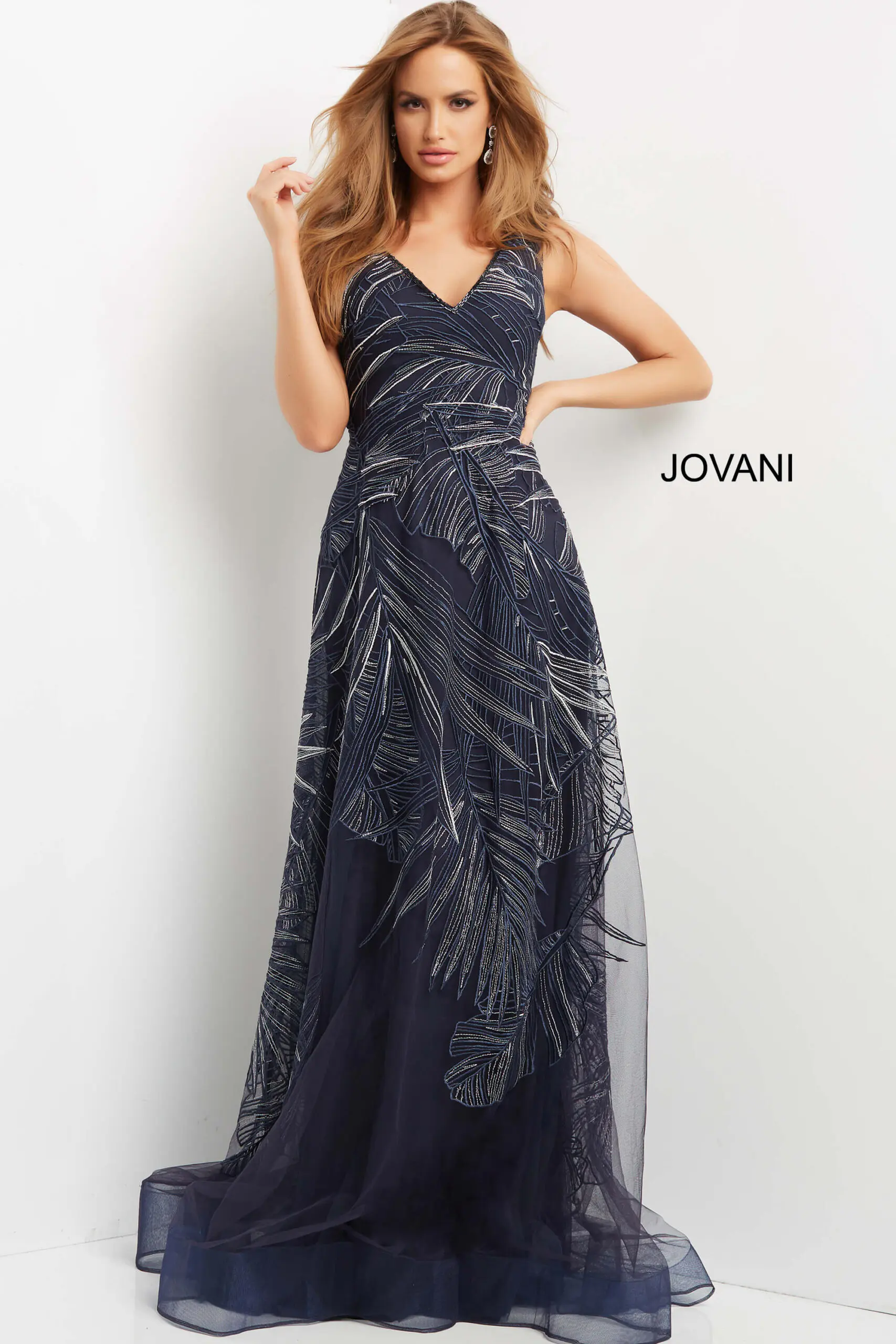 Model wearing Jovani 06829 navy evening gown with V-neckline