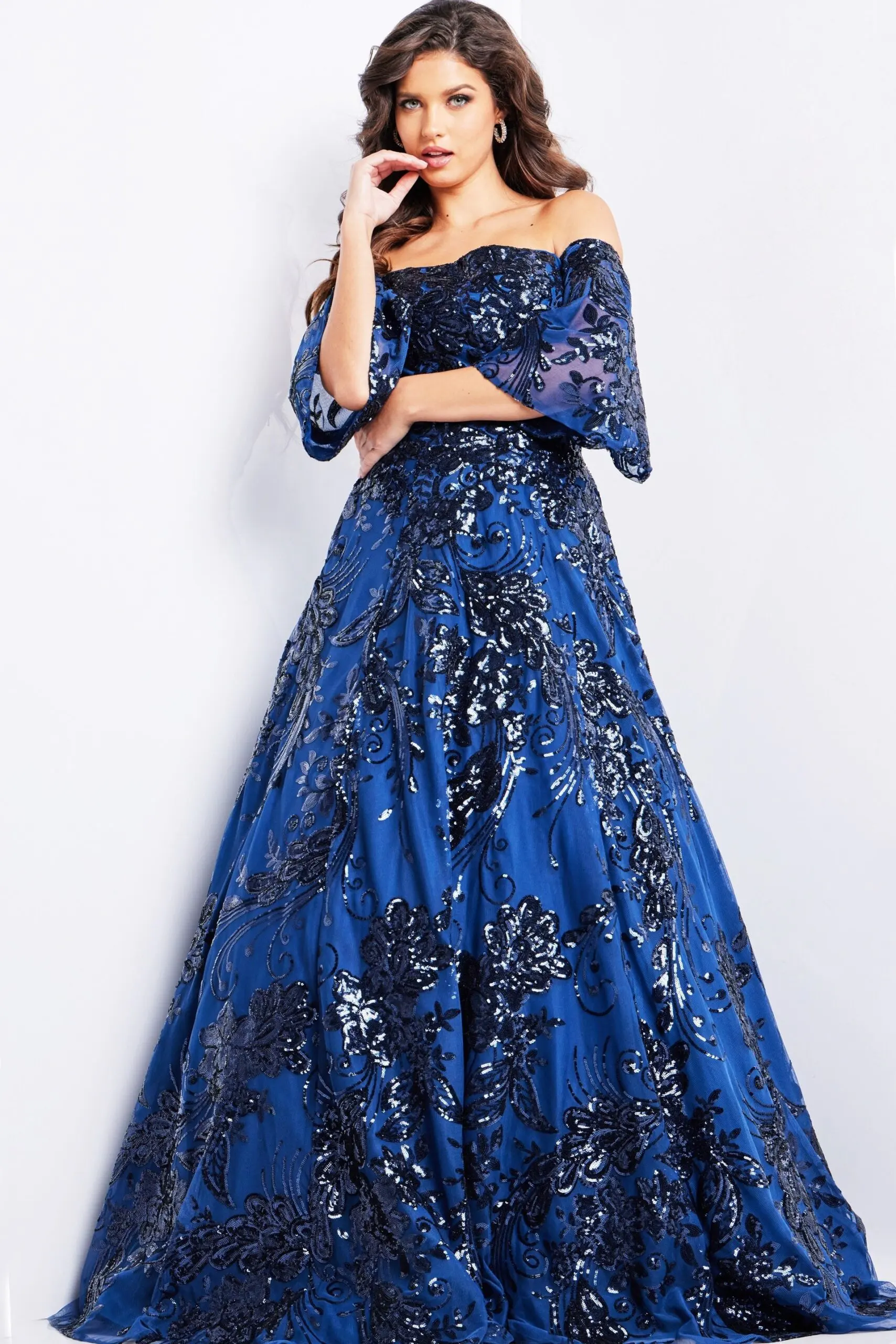 Model wearing Jovani 23765 navy dress, back view with shimmering sequin details.