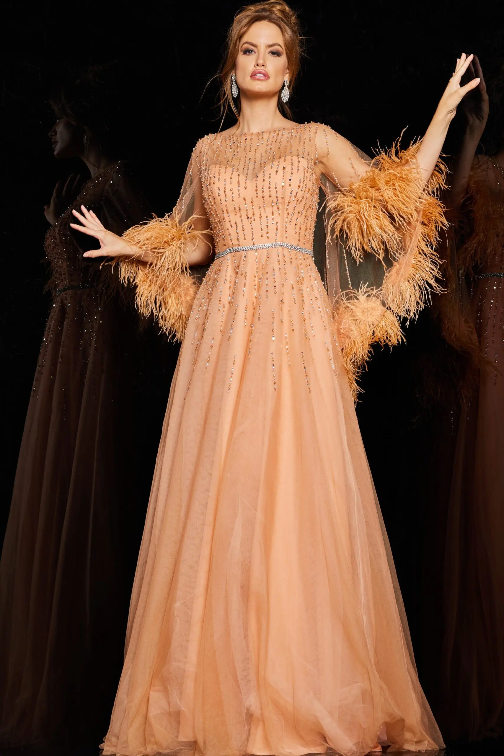 Model wearing Jovani 24559 cafe gown with illusion neckline and feathered sleeves