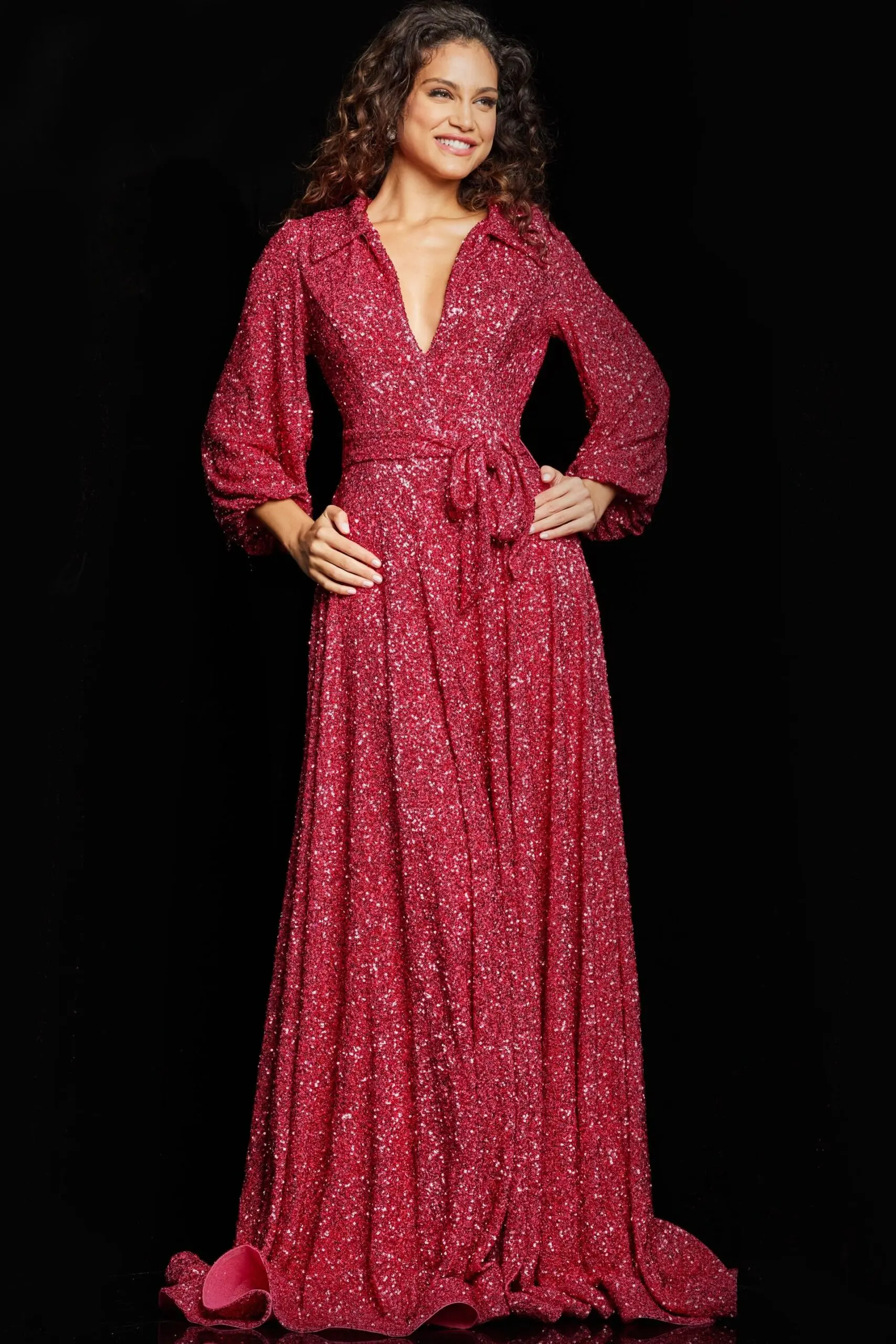 Model wearing Jovani 25950 red sequin gown with V-neckline.