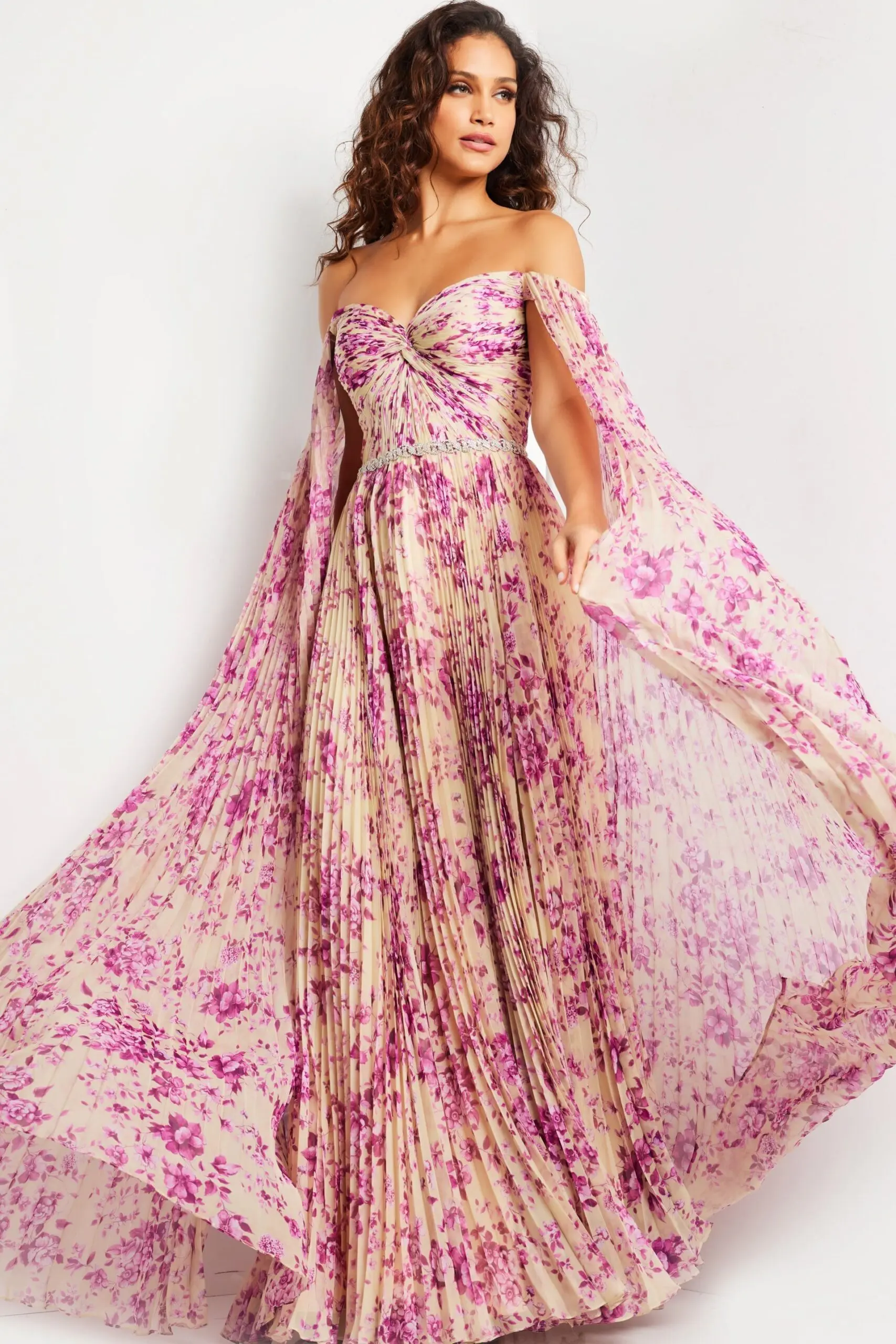 Model wearing Jovani 26141 in a printed pattern with flowing sleeves from the front view.