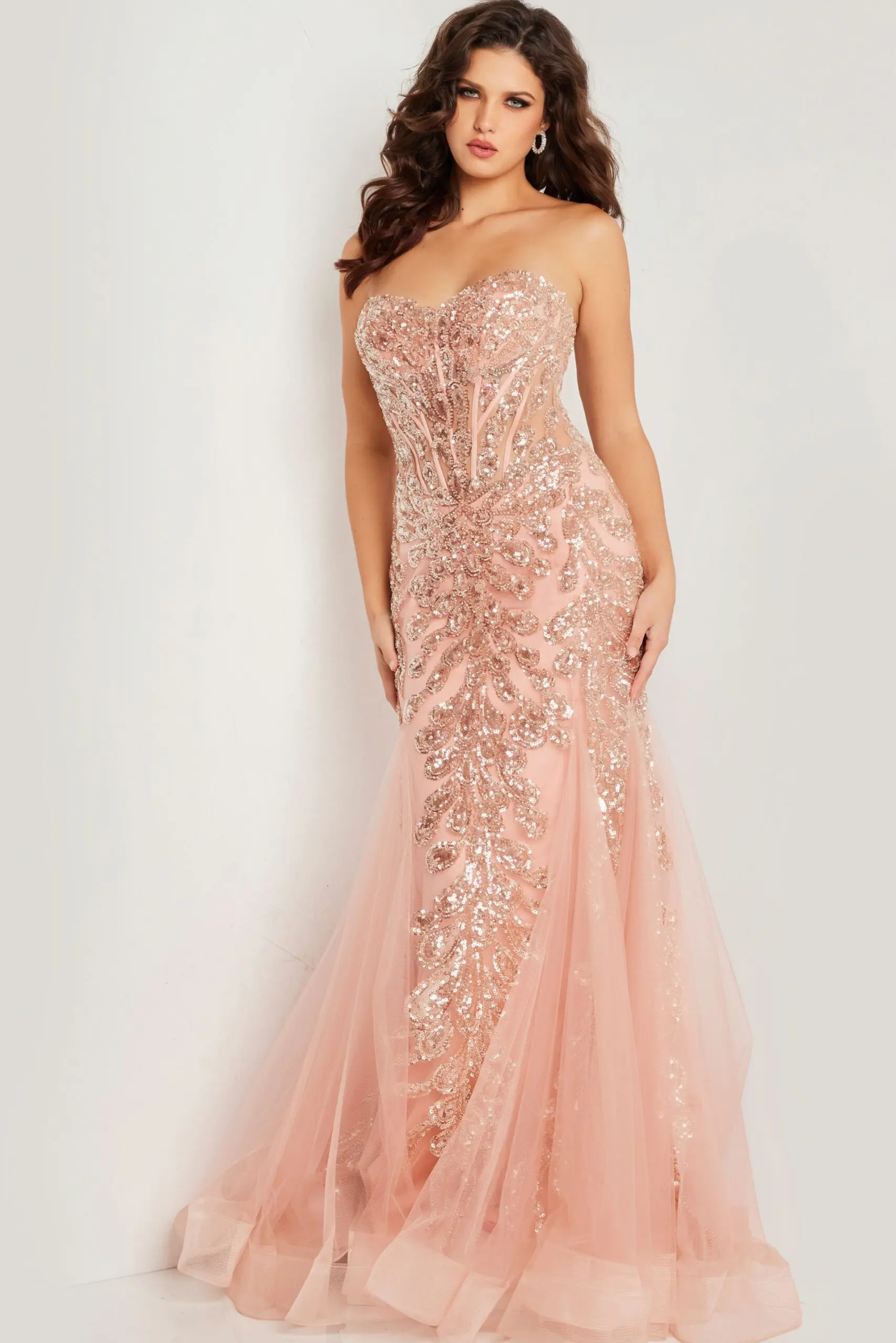 Model wearing Jovani 37412 blush gown with embellished bodice and strapless neckline