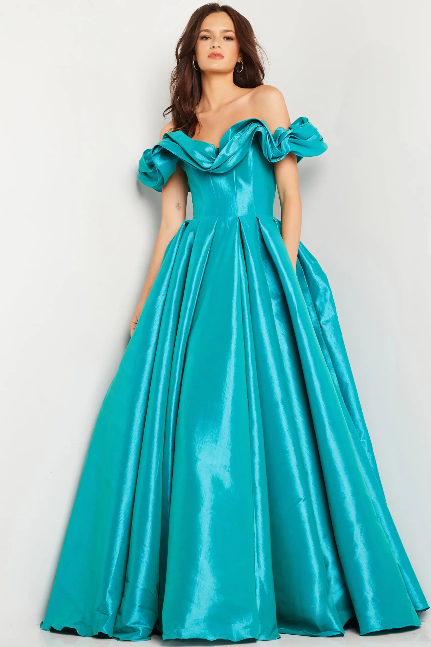 Model wearing Jovani 37476 aqua gown, front view.