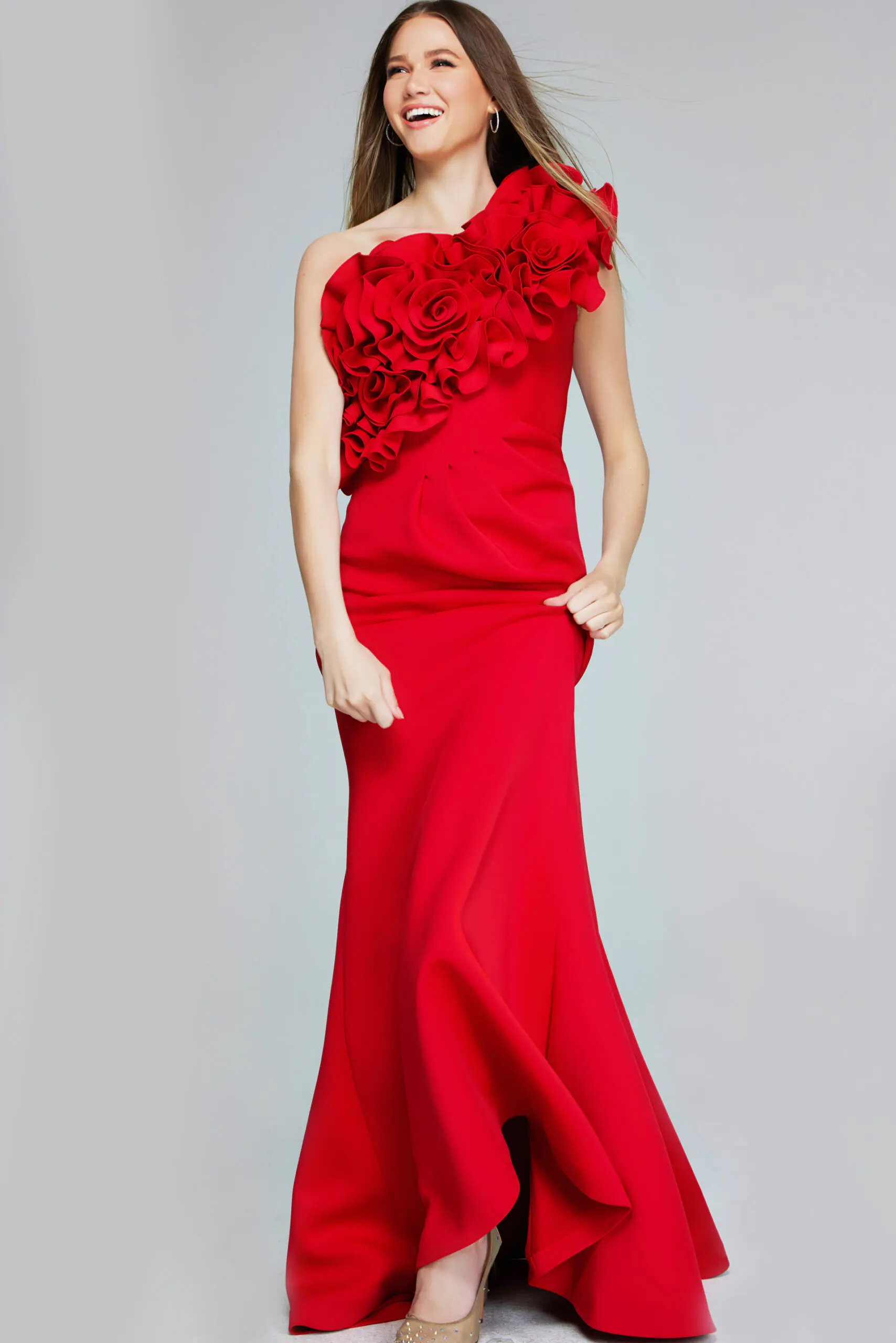 Model wearing Jovani 39751 red gown with ruffled one-shoulder neckline