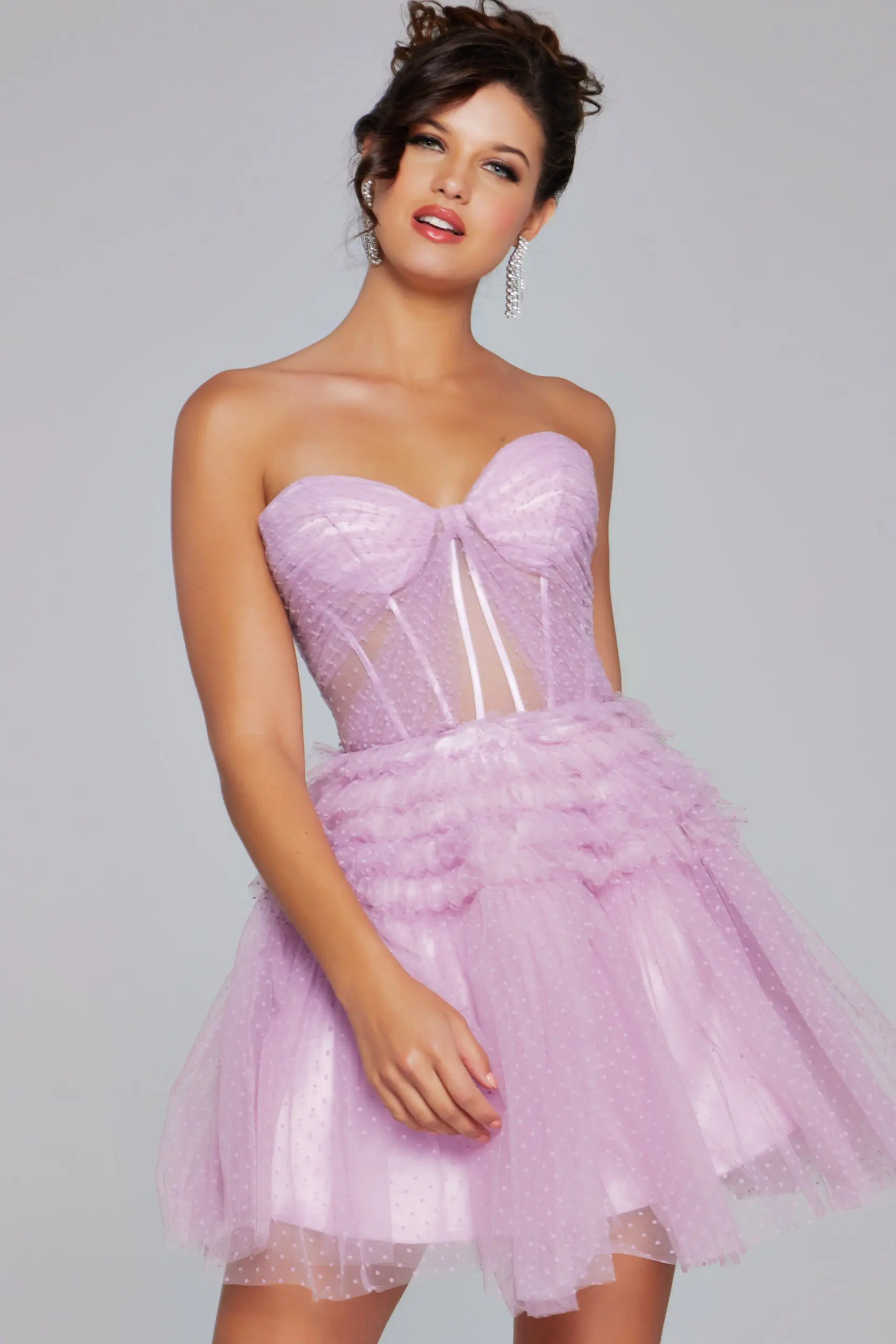 Model wearing Jovani 40467 lilac dress with sweetheart neckline and sheer paneling, front view