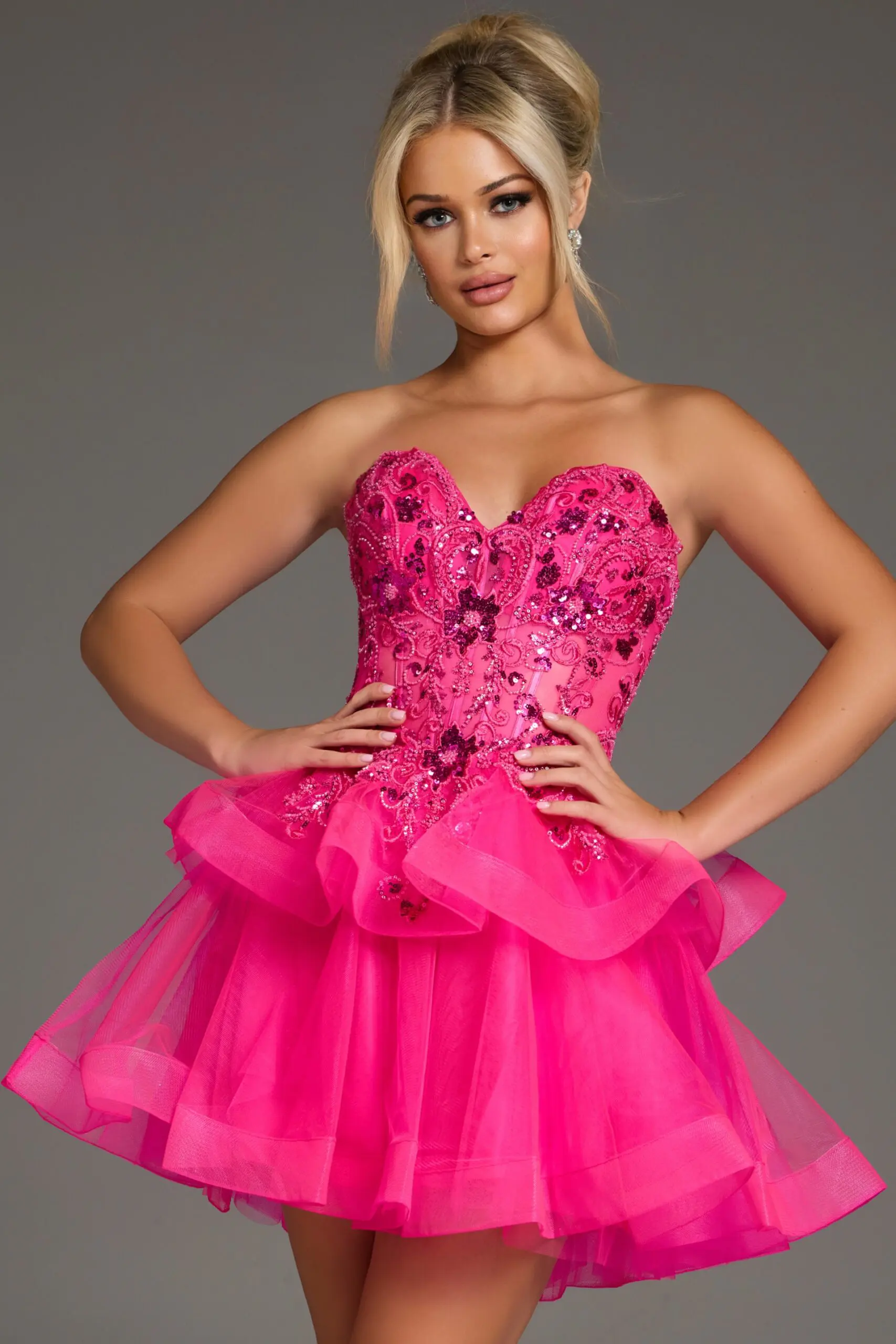 Model wearing Jovani 40503 pink dress with sweetheart neckline and layered skirt.