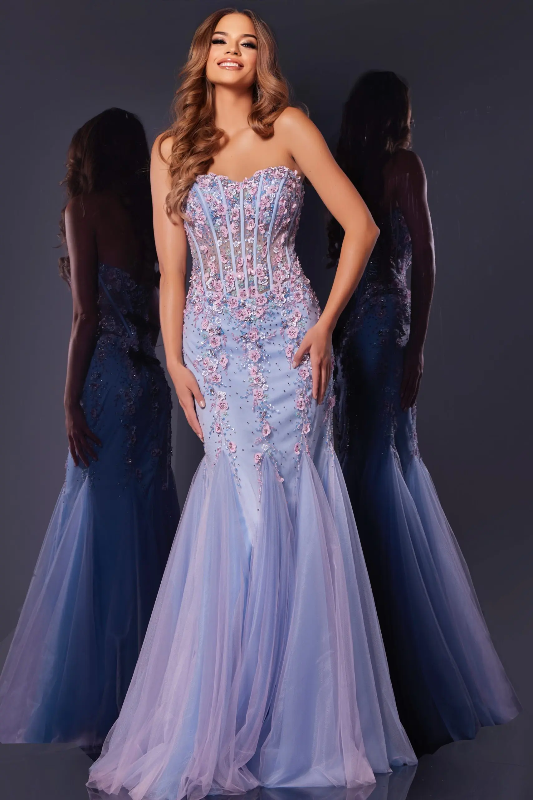 model wearing Jovani 44211 multi-color mermaid gown with floral embellishments