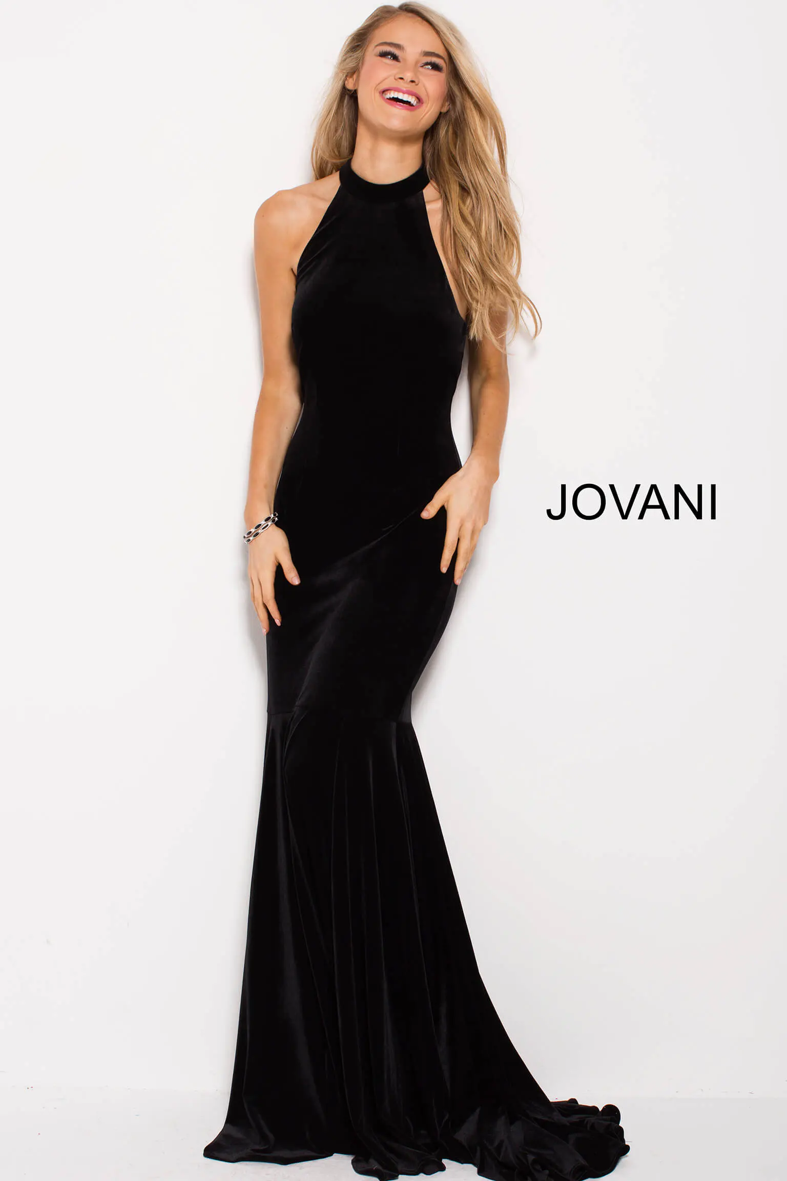 model wearing Jovani 51680 black velvet mermaid gown front view