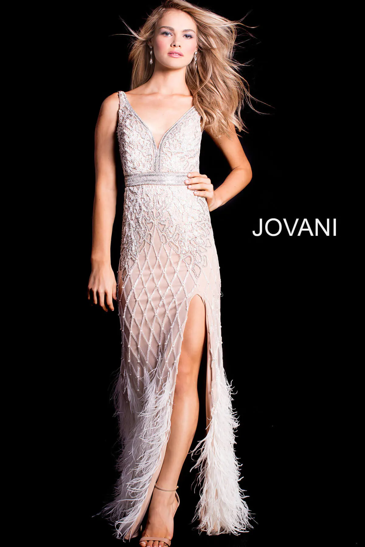 Model wearing Jovani 55796 ivory gown with intricate beading and feathered trim.