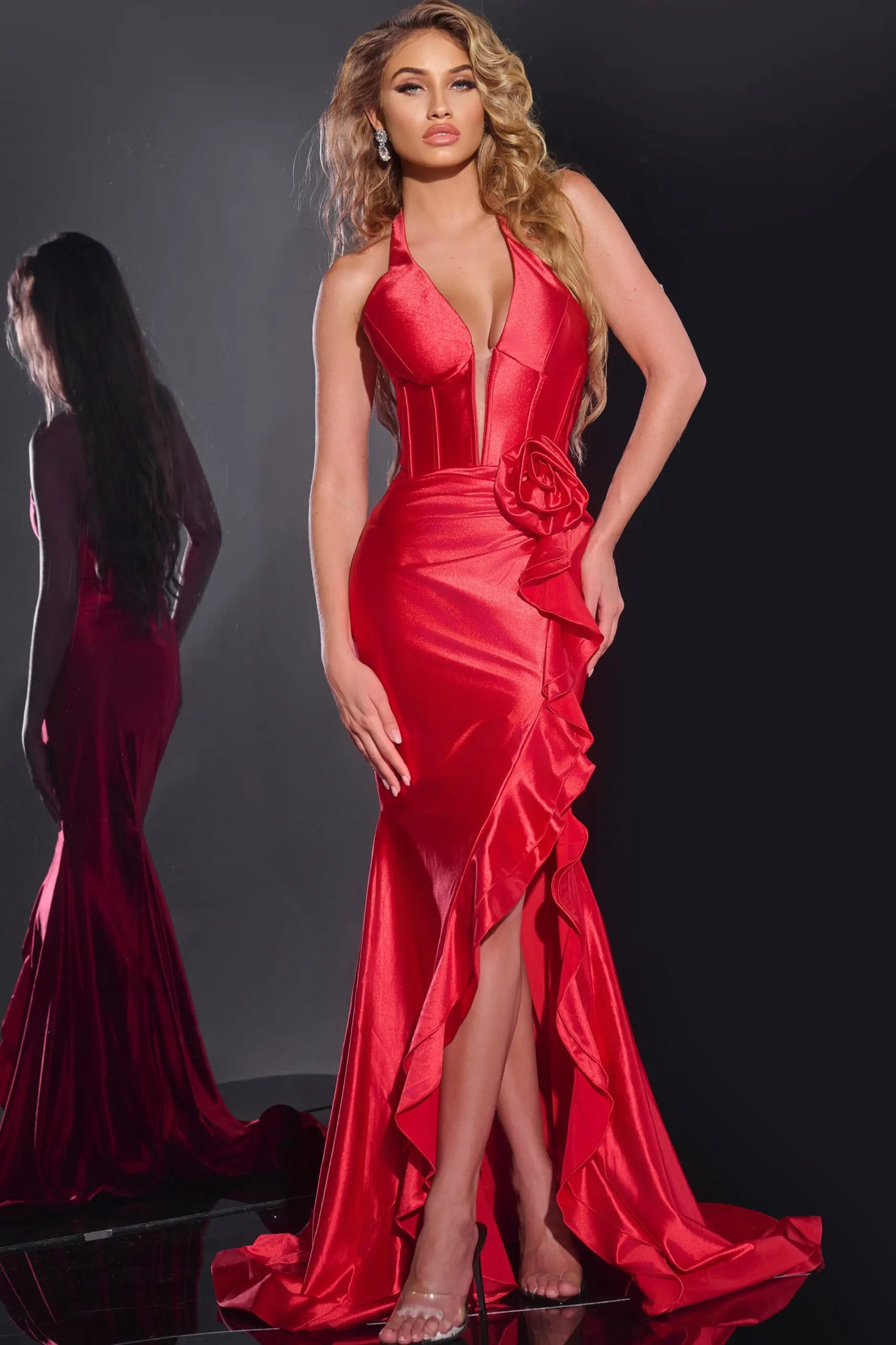 Model wearing Jovani D5306 red gown with V-neckline and floral applique