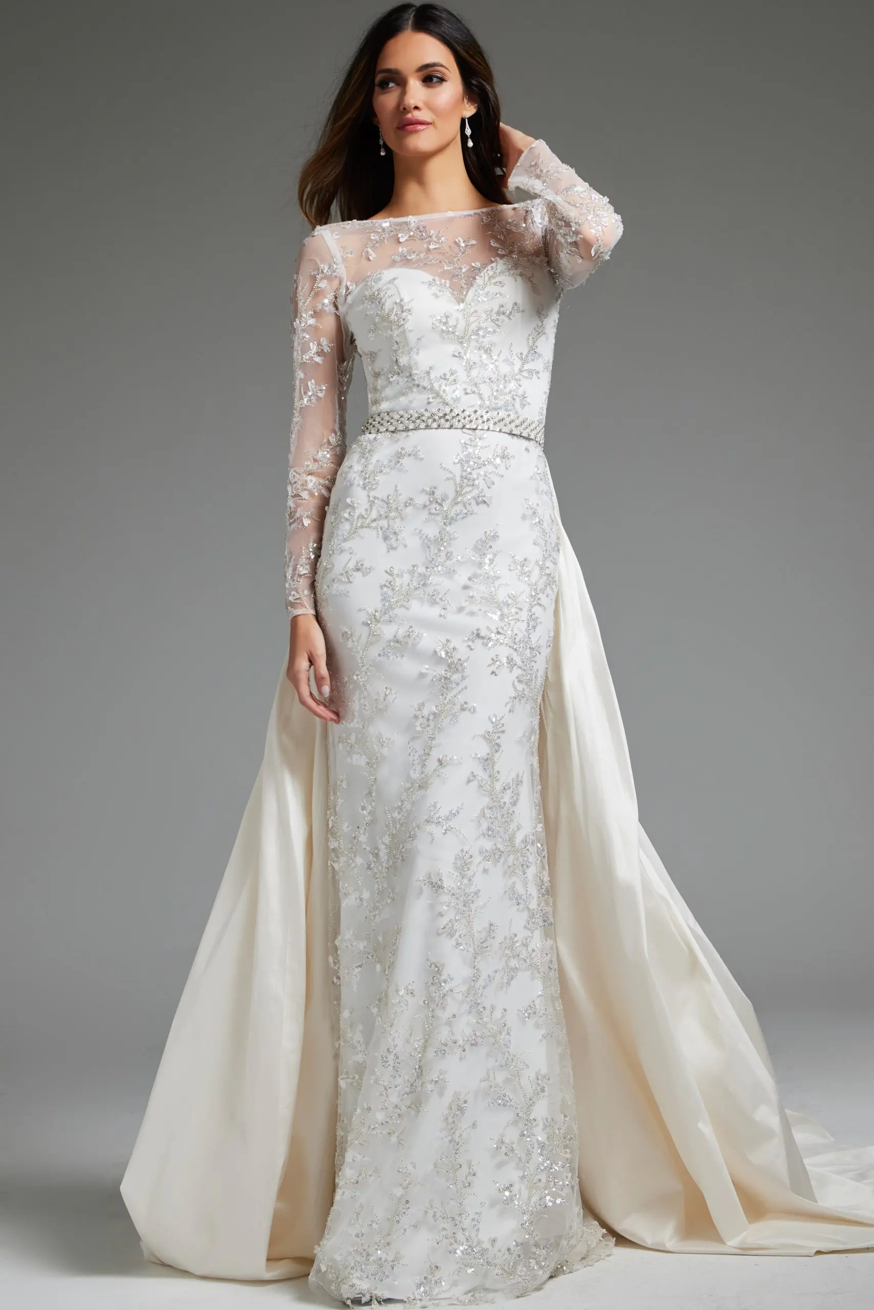 Model wearing Jovani JB07376 elegant white gown with illusion neckline and beaded embroidery.