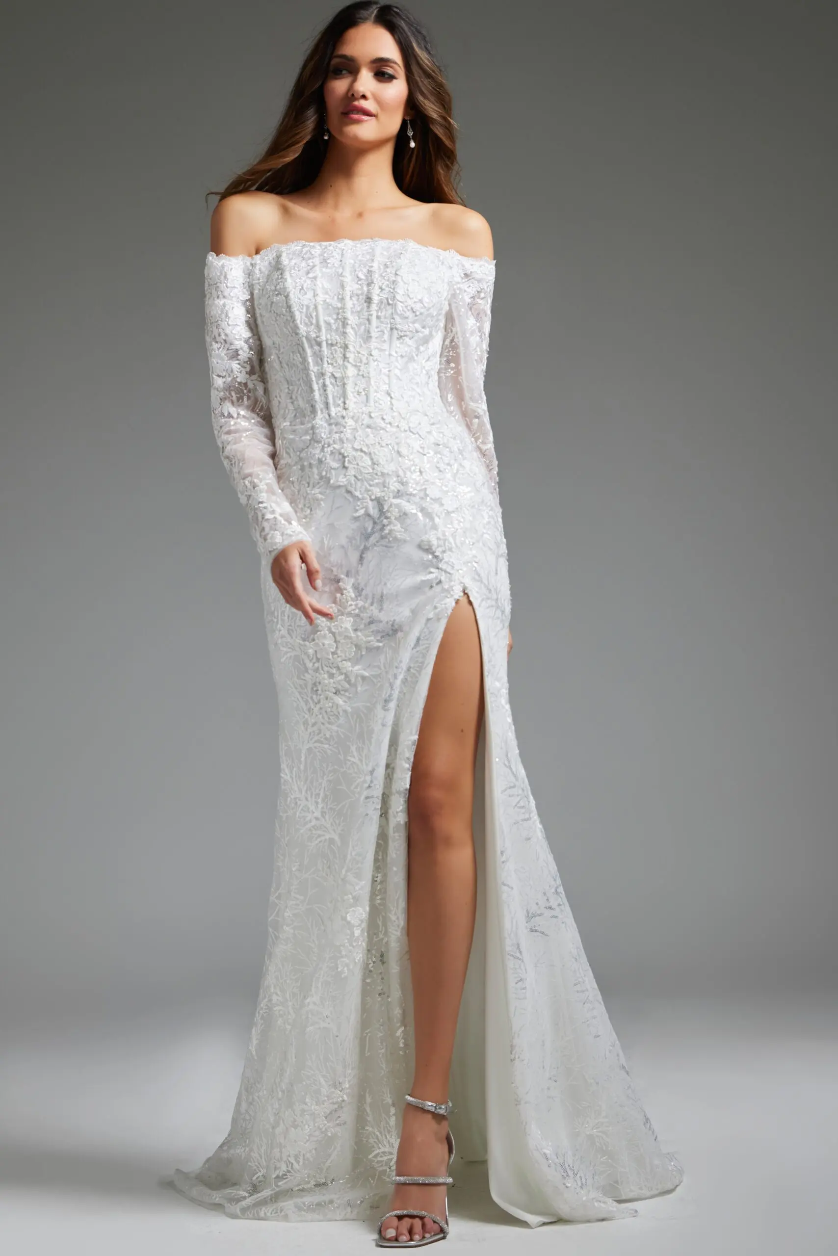 Model wearing Jovani JB23106 white lace gown with off-shoulder neckline, front view.