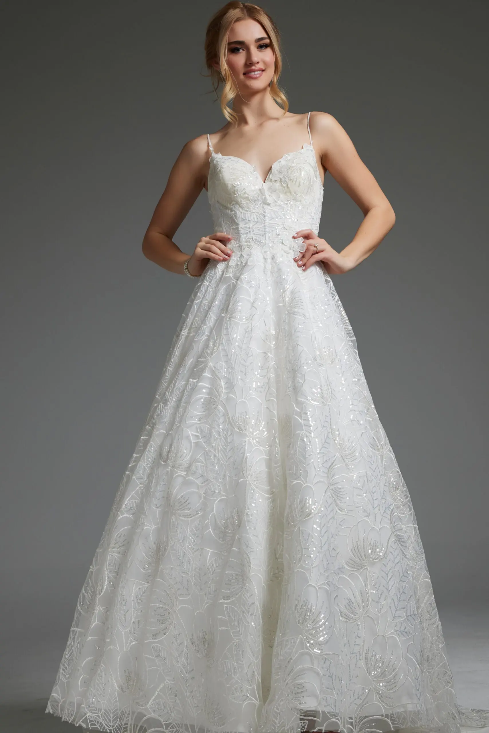 Model wearing Jovani JB422225 ivory gown with lace embroidery and sweetheart neckline, front view.