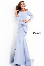 Model wearing Jovani 00446 light blue dress with mermaid silhouette and ruffle details.