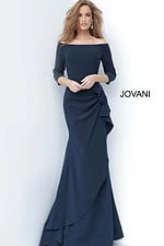 Model wearing Jovani 00446 navy dress with mermaid silhouette and off-the-shoulder neckline.