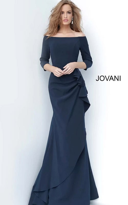 Model wearing Jovani 00446 navy dress with mermaid silhouette and off-the-shoulder neckline.