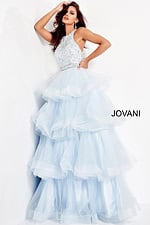 Model wearing Jovani 00461 light blue gown front view with layered skirt.