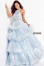 Model wearing Jovani 00461 light blue gown front view showcasing layered design.