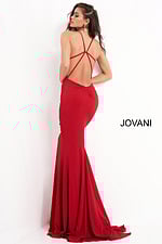 Model showing back detail of Jovani 00512 red dress with cross straps.