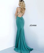 Model wearing Jovani 00512 green gown showing back with strap detailing.