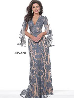 Model in Jovani 00752 navy lace gown, highlighting fitted silhouette and contrast details.