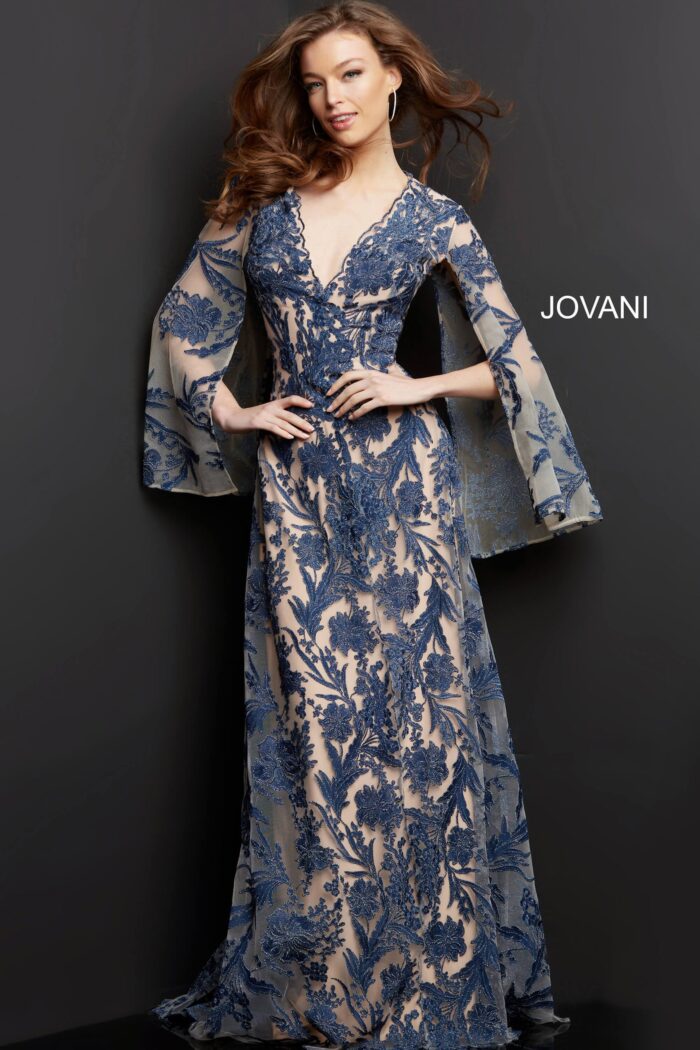 model wearing Jovani 00752 navy A-line gown with floral embroidery and bell sleeves