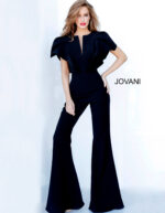 Model wearing Jovani 00762 black jumpsuit with V-neckline and flutter sleeves, front view.