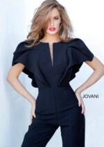 Model wearing Jovani 00762 black jumpsuit with V-neckline and flutter sleeves, front view.