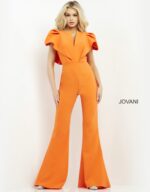 Model wearing Jovani 00762 orange jumpsuit with V-neckline and flutter sleeves, front view.