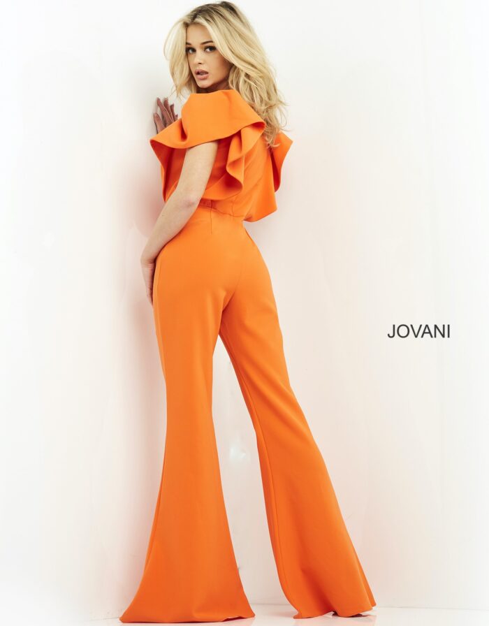 Model wearing Jovani 00762 orange jumpsuit with V-neckline and flutter sleeves, back view.