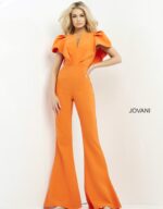Model wearing Jovani 00762 orange jumpsuit with V-neckline and flutter sleeves, front view.