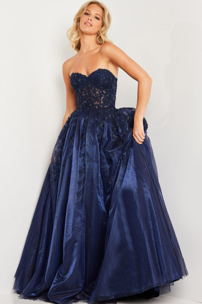 Model wearing Jovani 00915 navy gown with a sweetheart neckline and embroidered bodice.