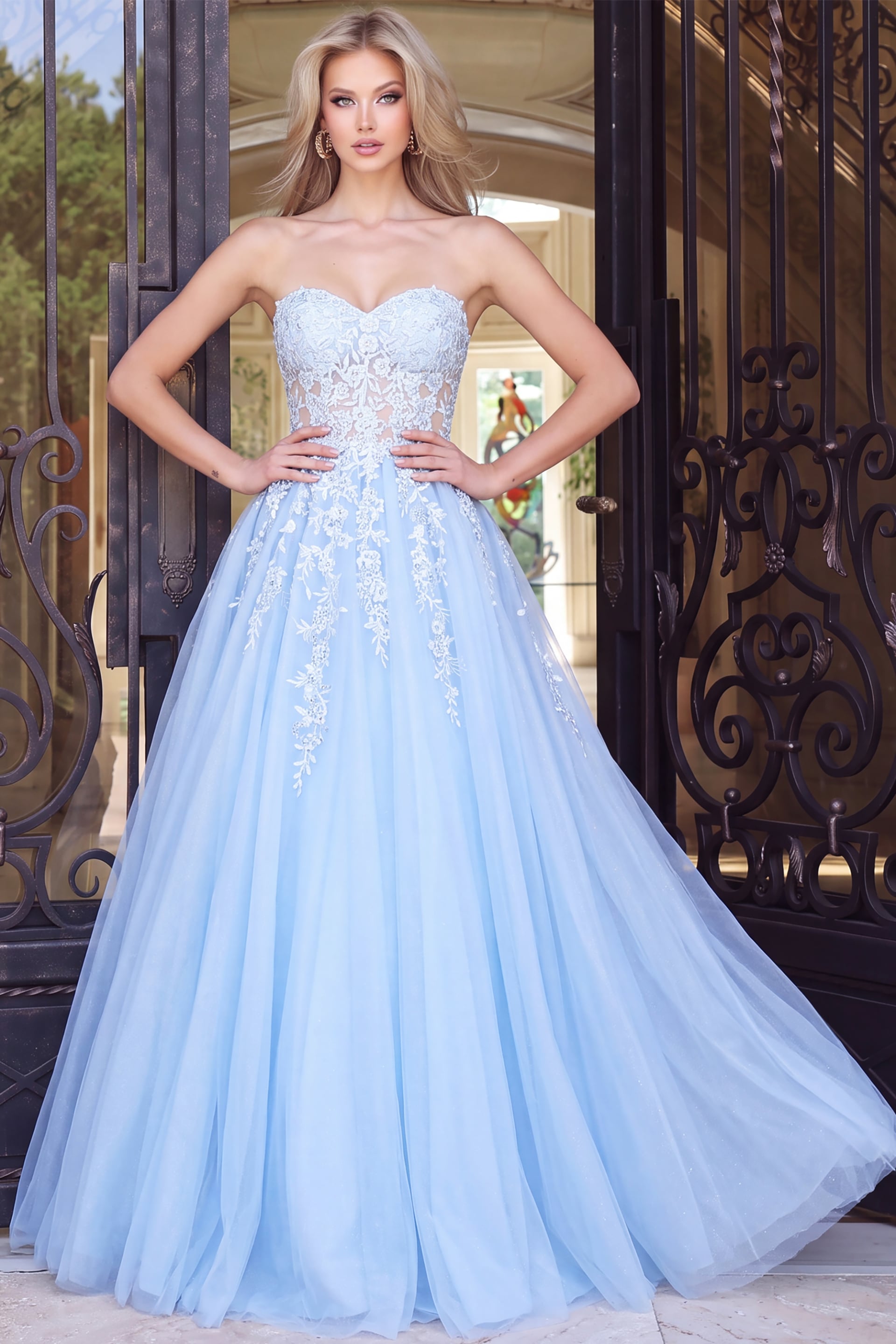 Light blue strapless ball gown with lace appliqué and a full tulle skirt.