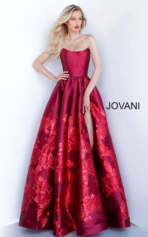 Model wearing Jovani 02038 elegant ball gown with floral embroidery and high slit.