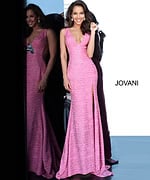 Model in Jovani 02472 Pink gown with high slit and deep V-neckline.