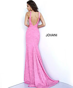 Back view of model in Jovani 02472 Pink gown with open back design.