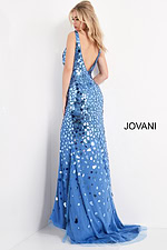 Model wearing Jovani 02479 blue gown featuring a low V-back design.
