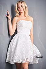 Model wearing Jovani K02564 white dress with floral appliqués from the front.