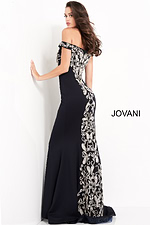 Model showing the back of Jovani 02576 navy gown with exquisite embroidery.
