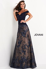Model wearing Jovani 02852 navy gown showcasing embroidered detail and off-the-shoulder neckline.