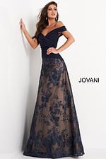 Model in Jovani 02852 navy gown with A-line silhouette and floral embroidery design.