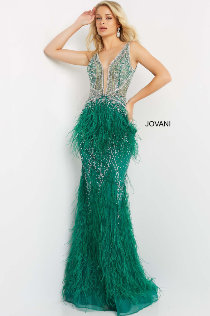 Model wearing Jovani 03023 emerald gown, front view with V-neck and elaborate feather details.