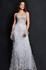 Model wearing Jovani 03023 gray gown with embellished bodice and feather details, front view.