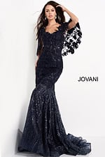 Model wearing Jovani 03158 navy dress with sequin details and cape sleeves, showcasing front view.