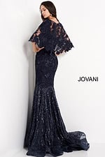 Model wearing Jovani 03158 navy dress with sequin details and cape sleeves, showcasing detailed back view.