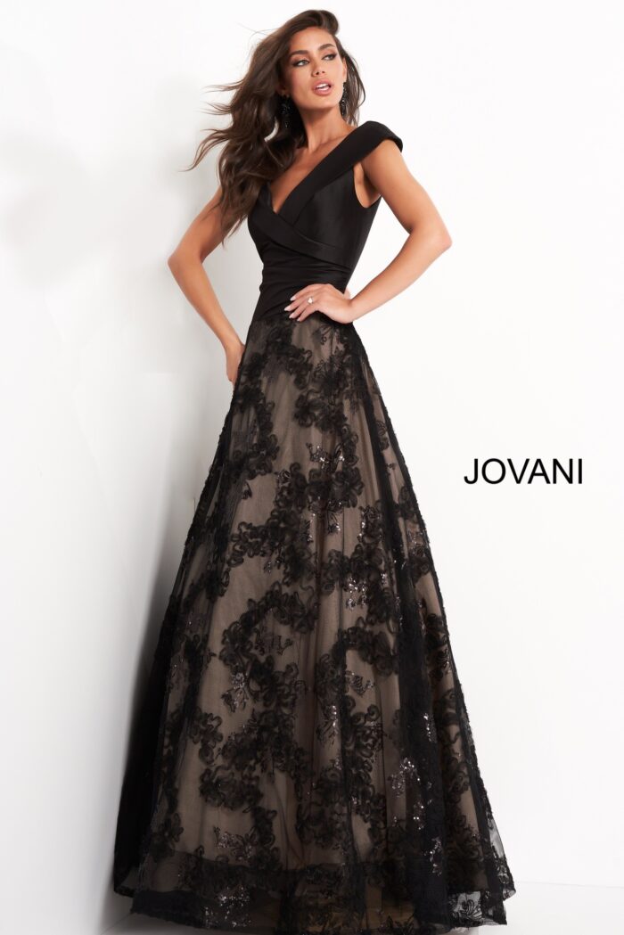Model wearing Jovani 03330 black dress, front angled view showing detailed lace appliques.