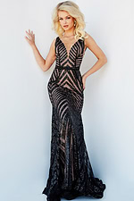 Model wearing Jovani 03570 black nude mermaid gown with intricate beadwork and V-neckline.